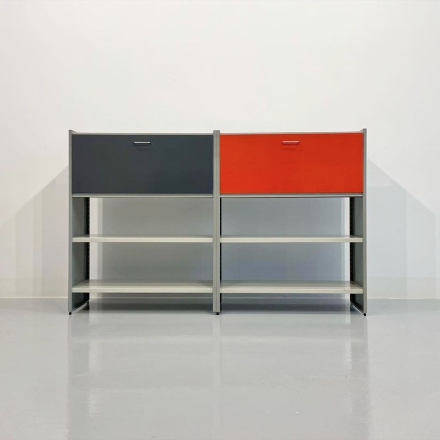 a cabinet with black and red doors